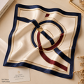 100% silk square scarf styled with travel accessories